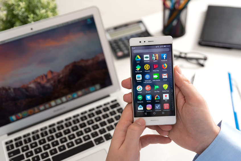 man holding huawei p9 device with android 7 nougat